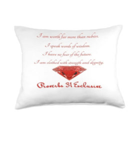 white pillow with red printed affirmations